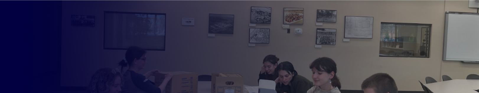 decorative image of team working together that fades into UConn Blue gradient.